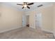 A spacious bedroom with neutral tones, carpeted floors, and a ceiling fan for added comfort at 630 Deberry Holw, Rock Hill, SC 29732