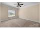 Bedroom with neutral walls, carpet, and a large window at 630 Deberry Holw, Rock Hill, SC 29732