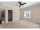 Bedroom with carpeted floors, crown molding, ceiling fan, and an ensuite bathroom at 630 Deberry Holw, Rock Hill, SC 29732