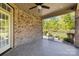 Relaxing covered patio perfect for outdoor entertaining and enjoying the serene backyard views at 630 Deberry Holw, Rock Hill, SC 29732