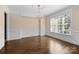 Elegant dining room with hardwood floors, decorative trim, a chandelier, and a large window for natural light at 630 Deberry Holw, Rock Hill, SC 29732