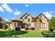 Stunning brick and stone home with manicured lawn and charming water fountain at 630 Deberry Holw, Rock Hill, SC 29732