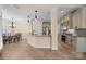 Open kitchen features granite counters, tile flooring, and stainless appliances, seamlessly connecting to the breakfast area at 630 Deberry Holw, Rock Hill, SC 29732
