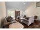 Inviting living room with vaulted ceilings, stone fireplace, and seamless flow to other areas at 630 Deberry Holw, Rock Hill, SC 29732