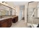 Spa-like main bathroom boasts dual vanities, a glass shower, and access to a walk-in closet at 630 Deberry Holw, Rock Hill, SC 29732