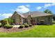 Landscaped backyard with a spacious patio, well-maintained lawn, and mature plantings at 630 Deberry Holw, Rock Hill, SC 29732