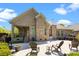Spacious backyard patio with chairs offers a relaxing outdoor living space in a beautiful brick home at 630 Deberry Holw, Rock Hill, SC 29732