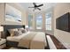 Bedroom with a ceiling fan, large windows, and neutral decor at 630 Deberry Holw, Rock Hill, SC 29732