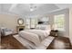 Primary bedroom featuring a fireplace, tray ceiling, and stylish decor at 630 Deberry Holw, Rock Hill, SC 29732
