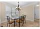 Elegant dining room with a glass table and ornate chairs at 630 Deberry Holw, Rock Hill, SC 29732