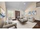 Bright living room with a cozy fireplace and elegant furnishings at 630 Deberry Holw, Rock Hill, SC 29732
