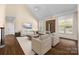 Bright living room with fireplace, chairs, sofa, and large windows at 630 Deberry Holw, Rock Hill, SC 29732