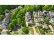 An aerial view shows a residential home, large yard, detached garage, and mature landscaping at 648 Revival Row, Fort Mill, SC 29708