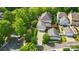 Aerial view of a charming home with a spacious backyard, detached garage and mature trees at 648 Revival Row, Fort Mill, SC 29708