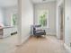 Bedroom with neutral carpet and paint, and comfortable seating area in the corner at 648 Revival Row, Fort Mill, SC 29708