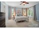 Bedroom with carpet, neutral walls, ceiling fan, and large windows offering natural light at 648 Revival Row, Fort Mill, SC 29708