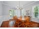 Formal dining room featuring natural light, hardwood floors and ample space for a large dining table at 648 Revival Row, Fort Mill, SC 29708