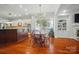 Open concept dining area features hardwood floors, natural light, and view into kitchen at 648 Revival Row, Fort Mill, SC 29708
