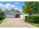 Three-car garage with extended driveway, screen porch and nice curb appeal at 648 Revival Row, Fort Mill, SC 29708