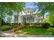Charming two-story home with a welcoming front porch and beautifully landscaped front yard at 648 Revival Row, Fort Mill, SC 29708