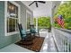 Relaxing front porch featuring rocking chairs, a ceiling fan, and a stylish outdoor rug at 648 Revival Row, Fort Mill, SC 29708