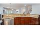 Bright kitchen features granite counters, stainless steel appliances and staircase access at 648 Revival Row, Fort Mill, SC 29708