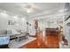Inviting living room with open concept floor plan, hardwood floors, and staircase access at 648 Revival Row, Fort Mill, SC 29708