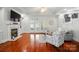 Bright living room with hardwood floors, fireplace, and access to the outdoor patio at 648 Revival Row, Fort Mill, SC 29708