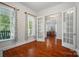 Office area with hardwood floors, trim, lots of light and doors leading to the dining room at 648 Revival Row, Fort Mill, SC 29708