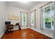Bright office space featuring hardwood floors, two large windows and a neutral color palette at 648 Revival Row, Fort Mill, SC 29708