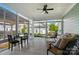 Bright sunroom with tiled floors, multiple windows, and cozy furniture, perfect for enjoying the outdoors at 648 Revival Row, Fort Mill, SC 29708