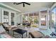 Charming sunroom with tiled flooring, plenty of natural light, and comfortable seating arrangements at 648 Revival Row, Fort Mill, SC 29708