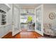 Inviting sunroom featuring glass doors, ceiling fan, and comfortable seating, creating a relaxing atmosphere at 648 Revival Row, Fort Mill, SC 29708