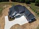 Aerial view of the home showcasing its expansive driveway and multiple garage spaces at 6511 Rehobeth Rd, Waxhaw, NC 28173