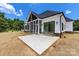 Backyard of home with screened porch and stone accents at 6511 Rehobeth Rd, Waxhaw, NC 28173