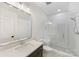 Bathroom with glass shower and dark wood vanity at 6511 Rehobeth Rd, Waxhaw, NC 28173