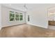 Bedroom featuring wood-look floors, recessed lighting and two large windows at 6511 Rehobeth Rd, Waxhaw, NC 28173