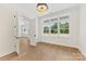 Bright bedroom featuring hardwood floors, a modern ceiling fan, and a large window at 6511 Rehobeth Rd, Waxhaw, NC 28173