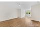 Bright bedroom with hardwood floors and white trim at 6511 Rehobeth Rd, Waxhaw, NC 28173