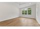 Bedroom featuring wood-look floors, a ceiling fan, recessed lighting and a large window at 6511 Rehobeth Rd, Waxhaw, NC 28173