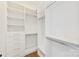 Walk-in closet with custom white shelving and drawers, providing ample storage space at 6511 Rehobeth Rd, Waxhaw, NC 28173