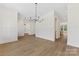 Elegant dining room with hardwood floors, wainscoting, and chandelier lighting at 6511 Rehobeth Rd, Waxhaw, NC 28173