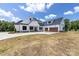 Beautiful two-story home with white siding, black trim and large garage at 6511 Rehobeth Rd, Waxhaw, NC 28173