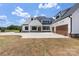 Beautiful two-story home with white siding, black trim and large garage at 6511 Rehobeth Rd, Waxhaw, NC 28173