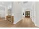 Inviting foyer featuring hardwood floors, stainless steel refrigerator, and a glass paneled entry door at 6511 Rehobeth Rd, Waxhaw, NC 28173