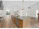Spacious kitchen with a large island, stainless steel appliances, and easy access to the living area at 6511 Rehobeth Rd, Waxhaw, NC 28173