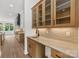 Butler's pantry with wooden cabinetry, marble countertops, and open access to the kitchen at 6511 Rehobeth Rd, Waxhaw, NC 28173