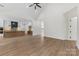 Open-concept living space featuring vaulted ceilings, hardwood floors, and a seamless transition to the modern kitchen at 6511 Rehobeth Rd, Waxhaw, NC 28173