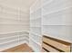 Spacious walk-in pantry with custom shelving for optimal organization and storage at 6511 Rehobeth Rd, Waxhaw, NC 28173