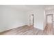 Cozy bedroom with wood-look floors conveniently located near an en-suite bathroom with a tiled shower at 6907 Lancaster Hwy, Waxhaw, NC 28173